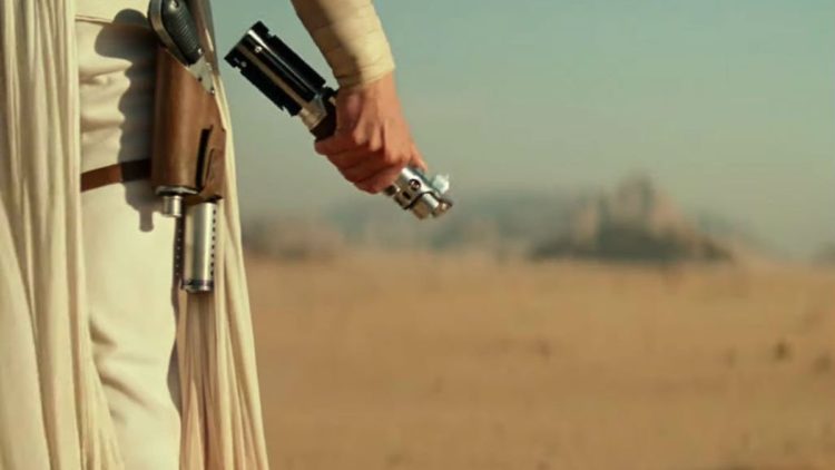 Rey holding a lightsaber in Star Wars: The Rise Of Skywalker